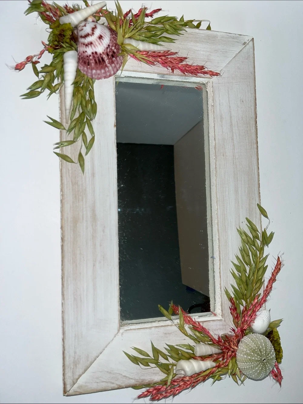 Coastal White Framed Wall Mirror with Pink Shell and Green Foliage Accents